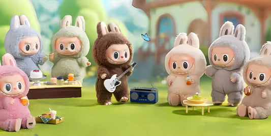 A group of cute Labubu doll characters in bunny costumes enjoys a picnic with food and music in a vibrant outdoor setting.