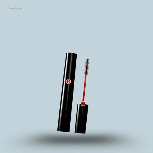 Armani Beauty Black Ecstasy Mascara black bottle with mascara applicator on blue background — LBK