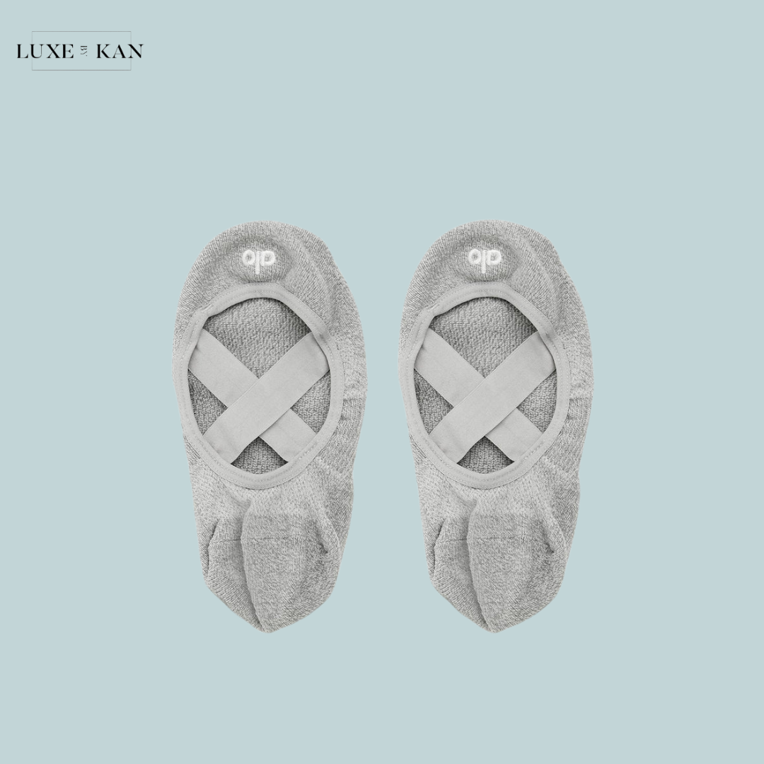 A pair of light gray Alo women’s Pivot Barre socks, showcasing a comfortable and stylish design.