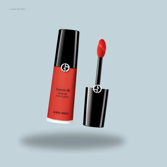 Armani Beauty Luminous Silk Cheek Tint in a vibrant red shade, featuring a sleek tube and precise applicator for a radiant, buildable flush.