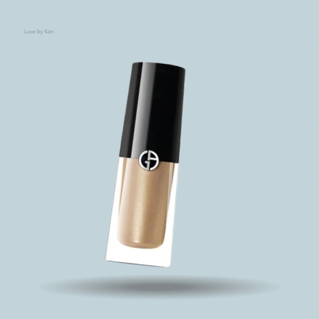 Armani caramel liquid eyeshadow tube with black lid.