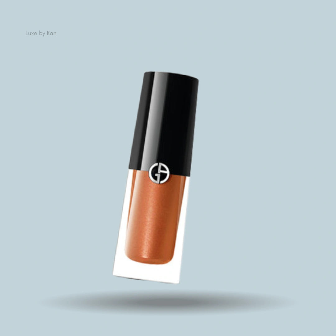 Armani caramel-colored liquid eyeshadow with black cap.
