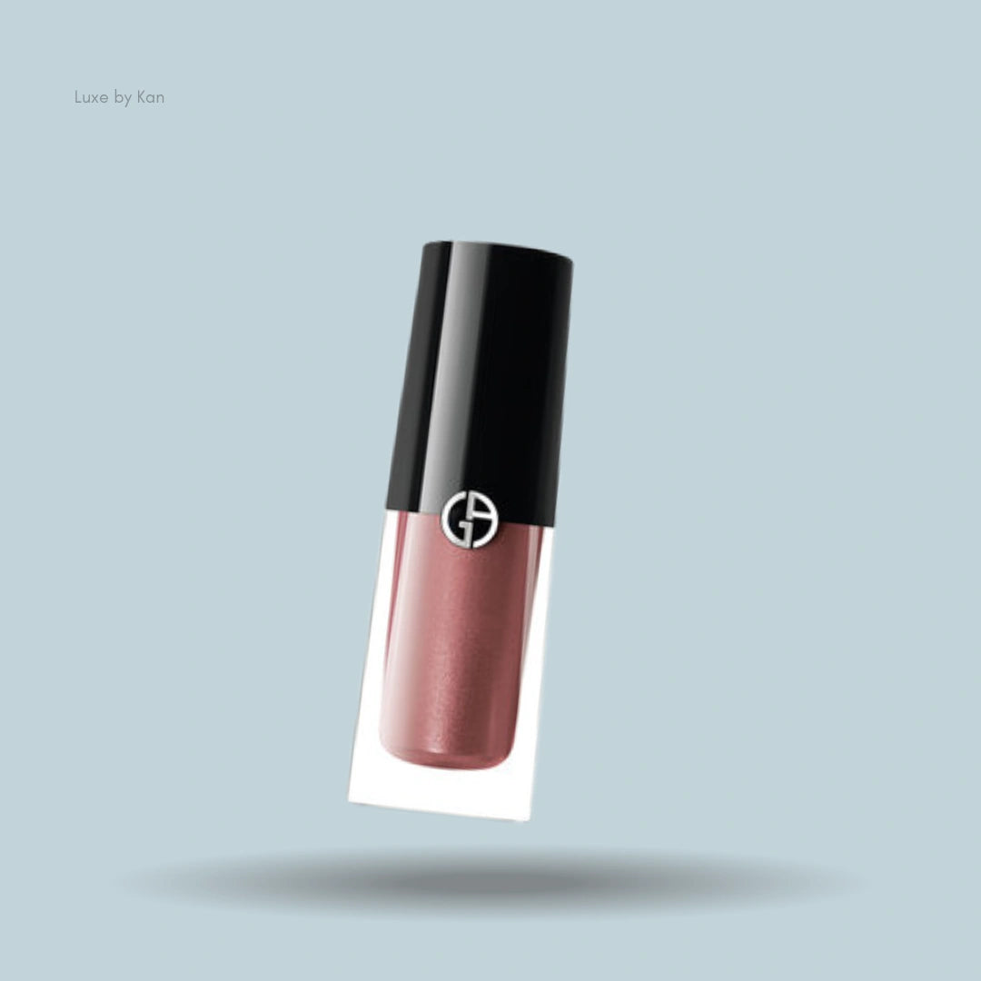 Armani liquid eyeshadow, caramel colored, with black cap.
