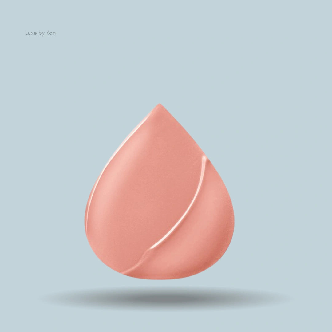 Peach-colored droplet sample swatch of Armani Lip Power lipstick.