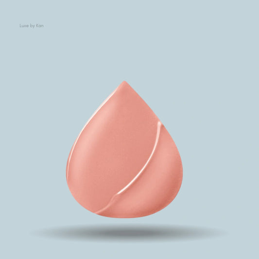 Peach-colored droplet sample swatch of Armani Lip Power lipstick.