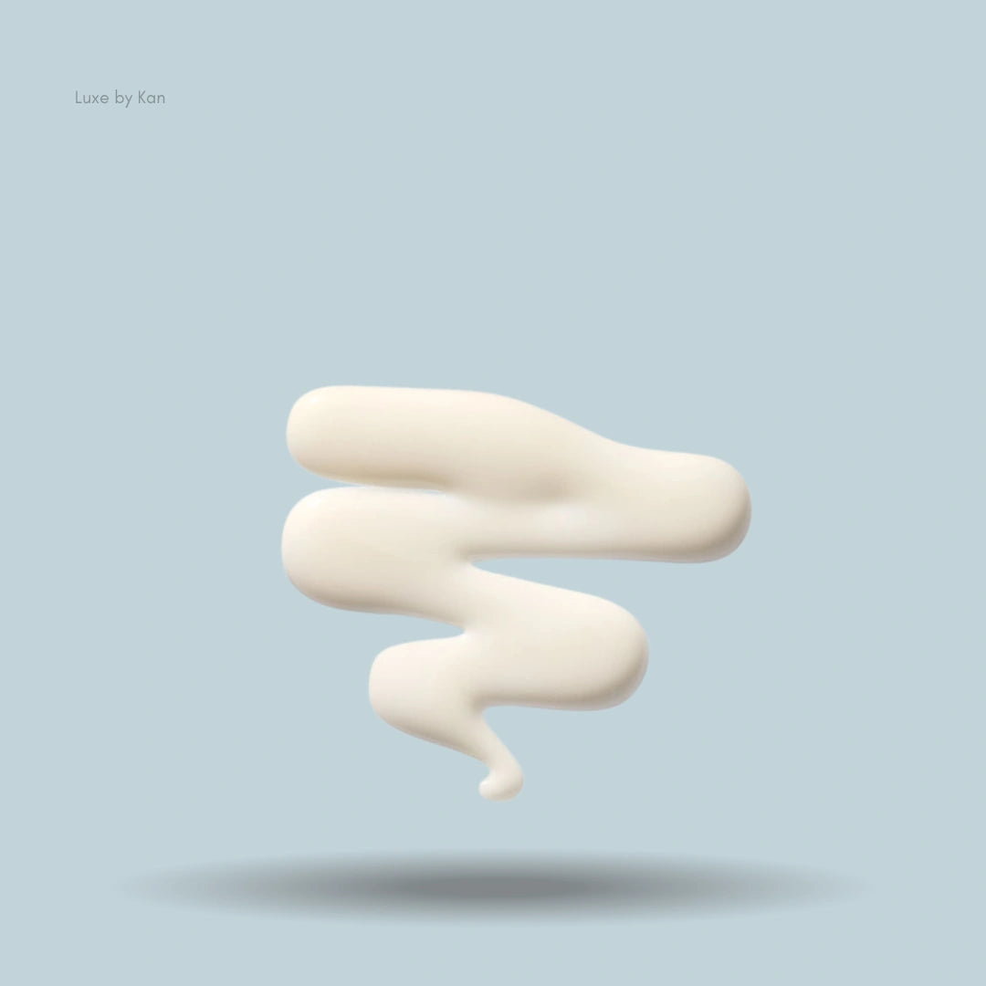Swirl of white Augustinus Bader The Leave-In Hair Treatment product against a light blue background.