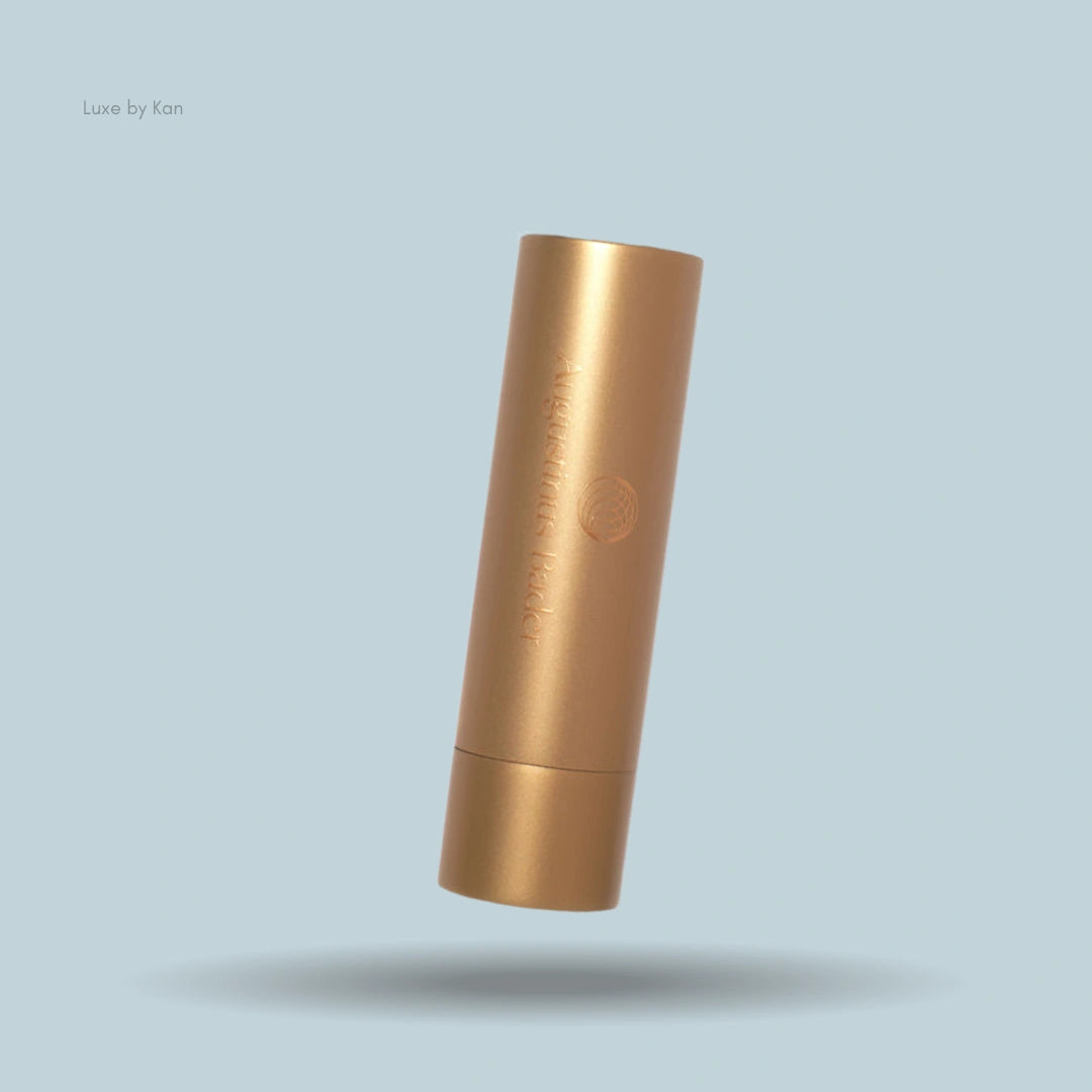 Augustinus Bader "The Lip Balm" in gold packaging.