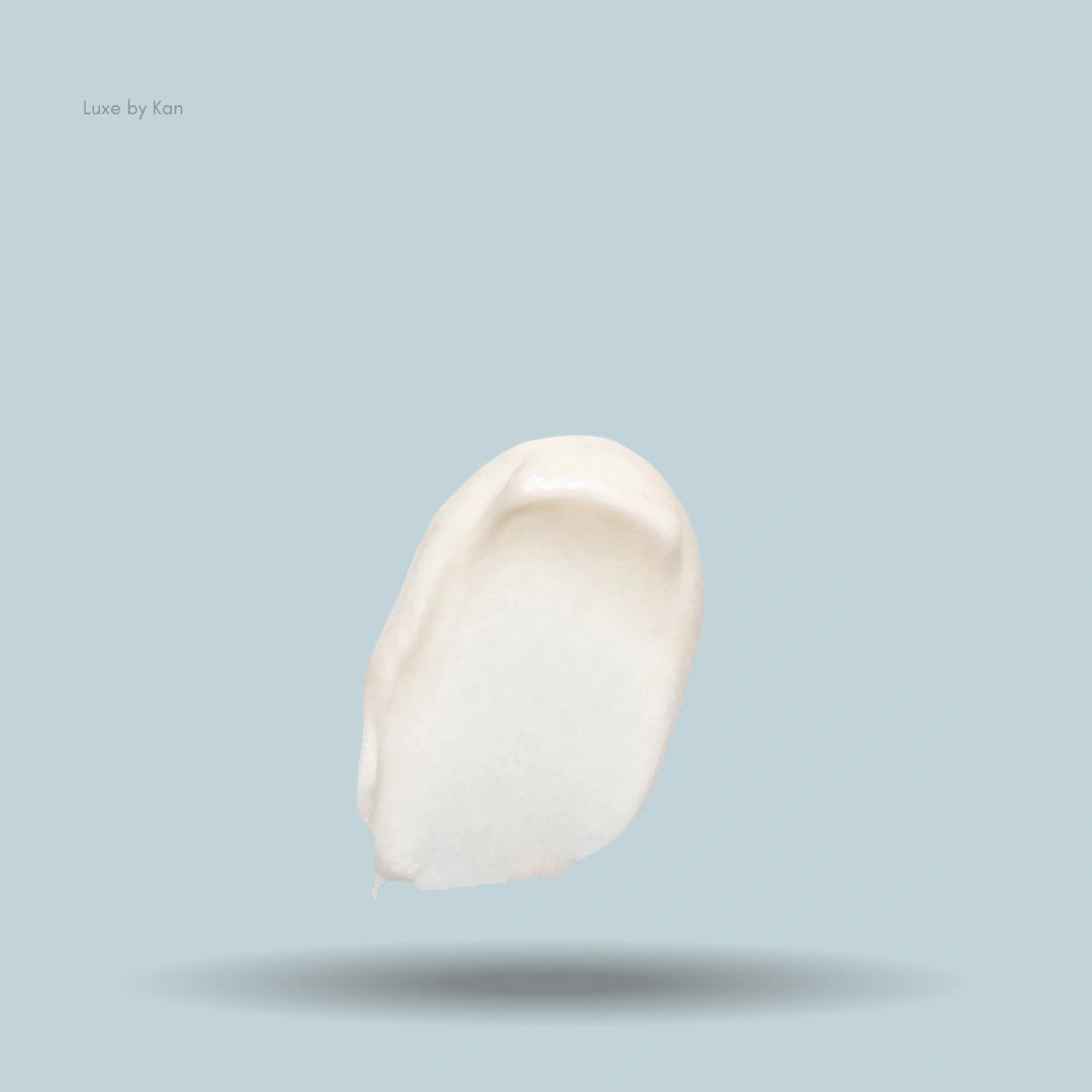 Swatch of white Augustinus Bader Ultimate Soothing Cream.