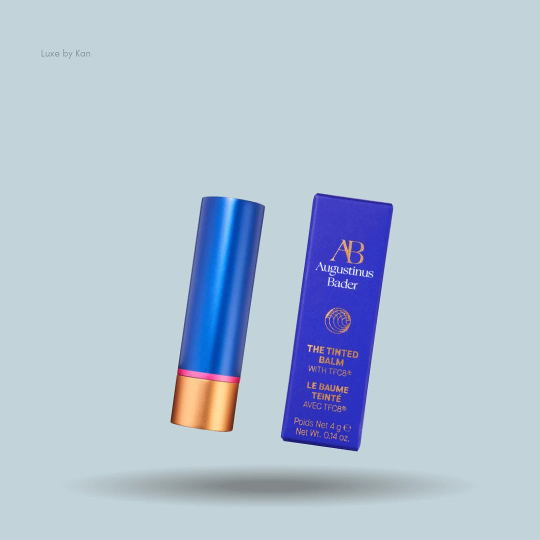 Augustinus Bader tinted balm and box, blue and gold packaging.