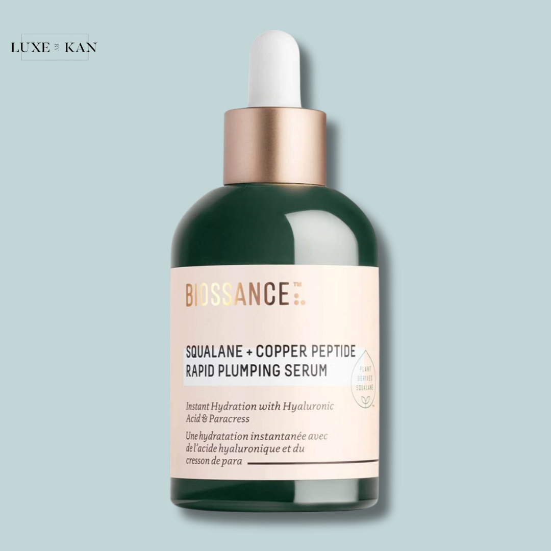 Green glass bottle of Biossance Squalane + Copper Peptide Rapid Plumping Serum with dropper, featuring hydrating claims in French and English.