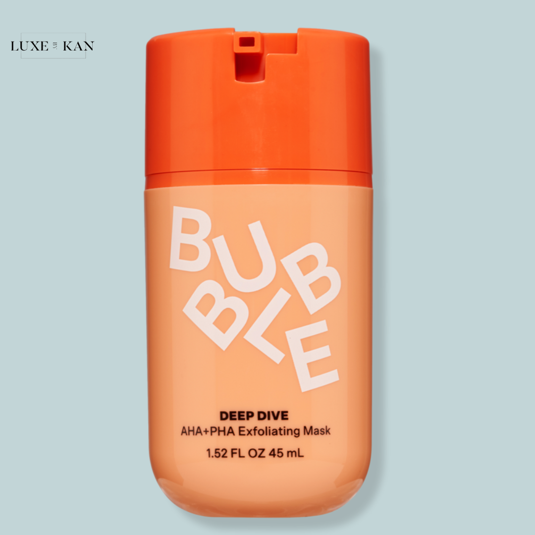 A bottle of Bubble Deep Dive AHA+PHA Exfoliating Mask, featuring a bright orange cap and peach-colored body, labeled prominently.