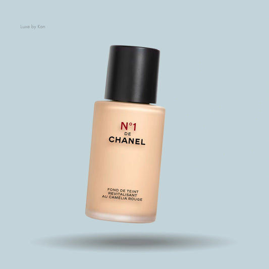 Chanel N°1 Revitalizing Foundation in a glass bottle with a black cap.