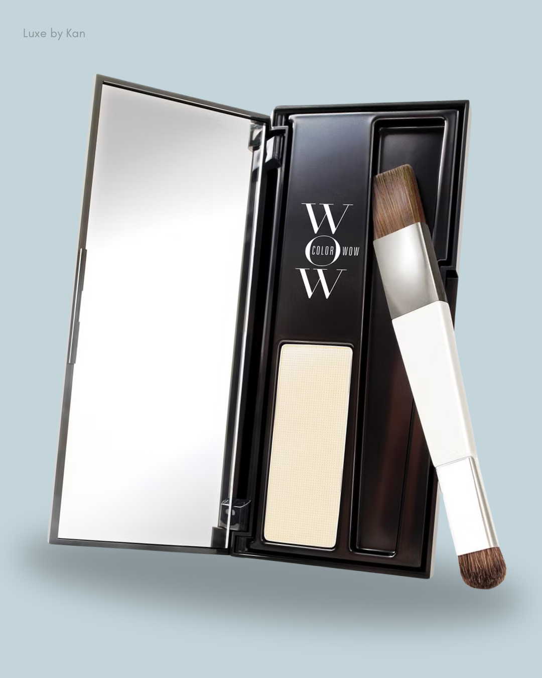 An open black compact of Color Wow Root Cover Up, featuring a mirror, a beige powder pan, and a brush with a white handle.