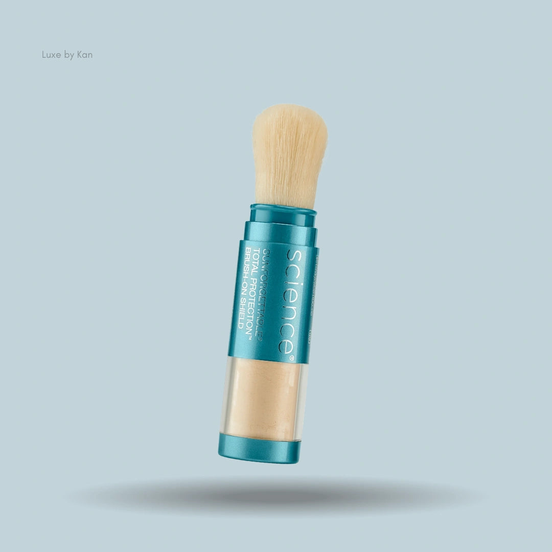 Colorescience Sunforgettable Total Protection Brush-On Shield SPF 50 displaying teal packaging, a powder reservoir, and an attached brush.