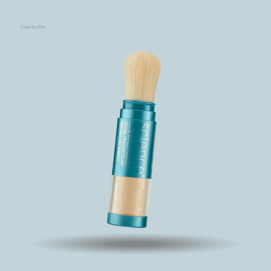 Colorescience Sunforgettable Total Protection Brush-On Shield SPF 50 displaying teal packaging, a powder reservoir, and an attached brush.