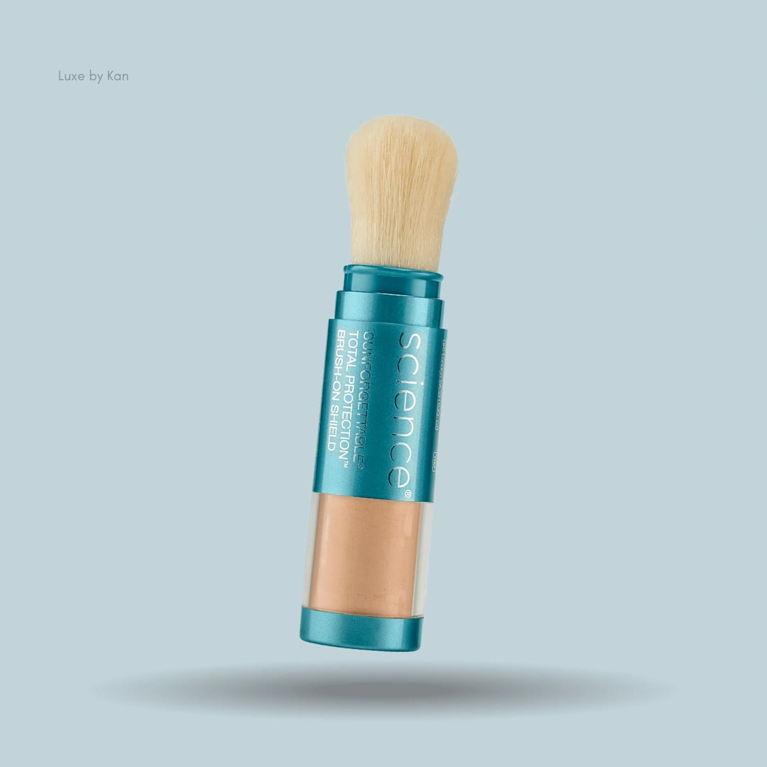Colorescience Sunforgettable Total Protection Brush-On Shield SPF 50 with dispenser brush on a blue background.