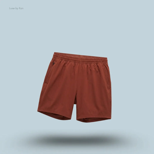 Lululemon Pace Breaker Linerless Short 7" in cranberry charm, front view on light blue background