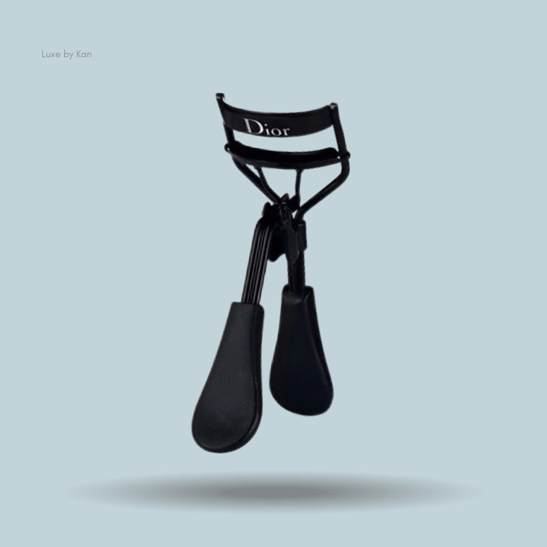 Black Dior backstage eyelash curler with logo.