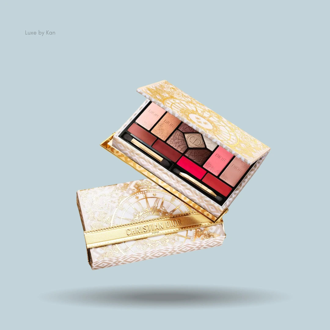 Dior couture multi-use face palette open, showing eyeshadows, lip colors, and applicators, with a gold and white pattern box beneath.