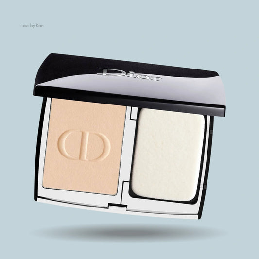 Open Dior Forever Natural Velvet powder foundation compact, revealing the powder with CD monogram and applicator sponge.