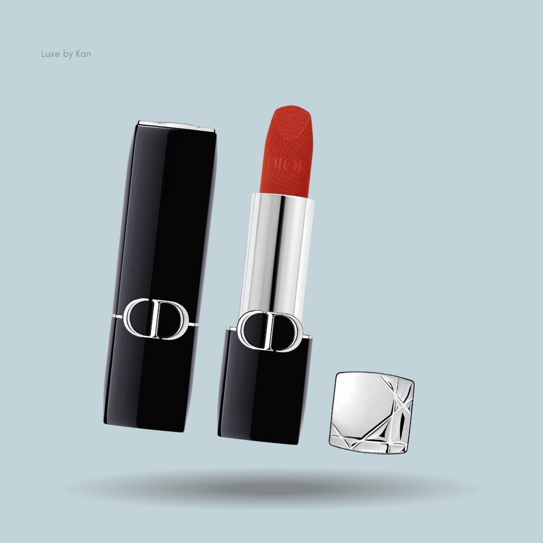 Dior Rouge Velvet Lipstick, open to reveal its rich bullet, encased in a sleek silver and black case.