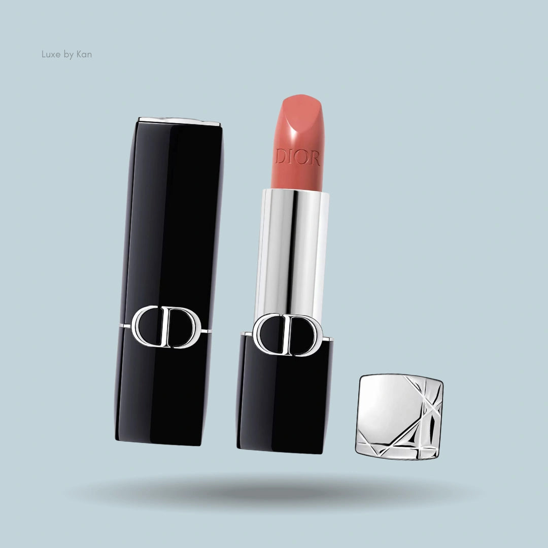 Dior Rouge New Velvet lipstick in a black and silver case, with cap removed.