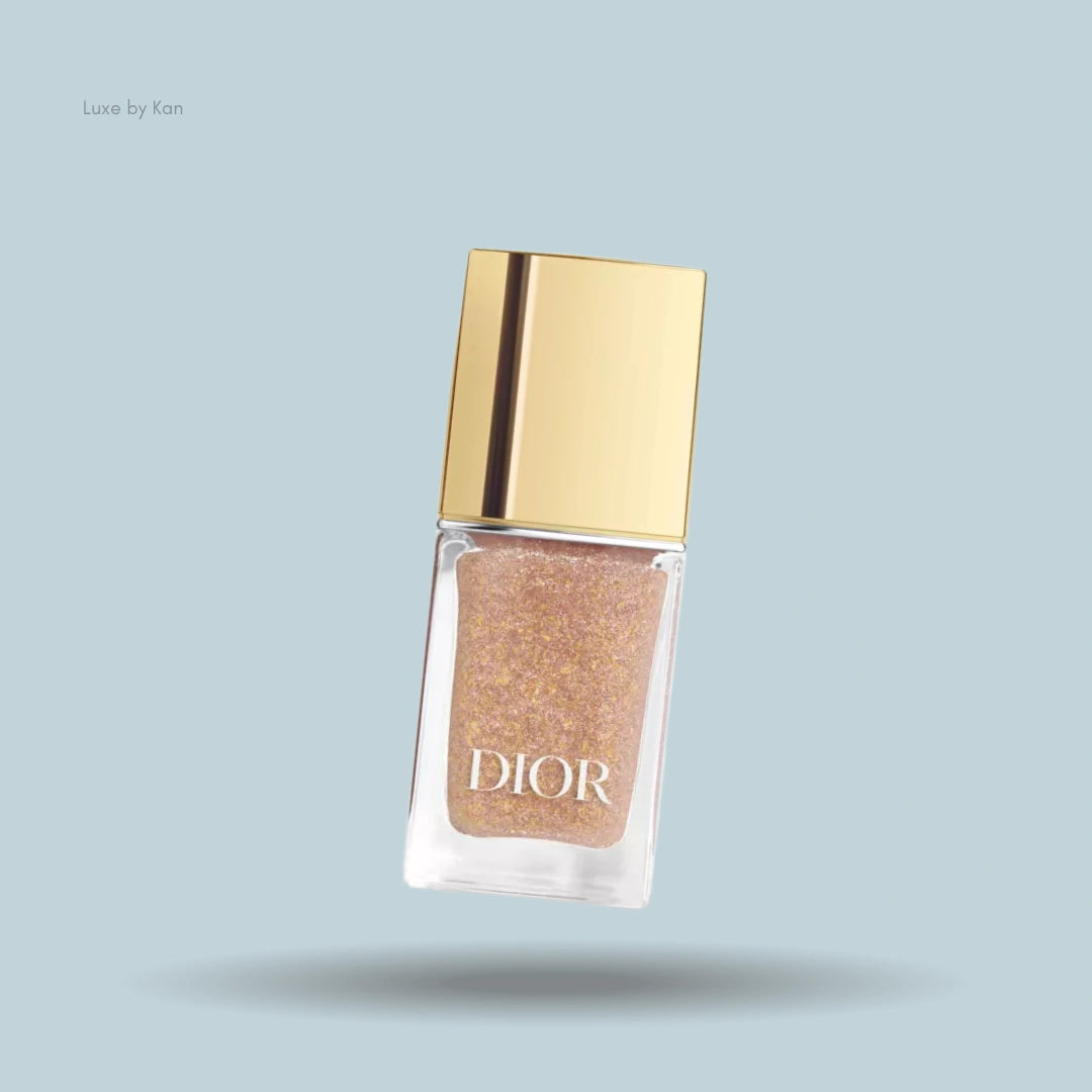 Dior Vernis Top Coat nail polish bottle, filled with glitter polish and golden cap.