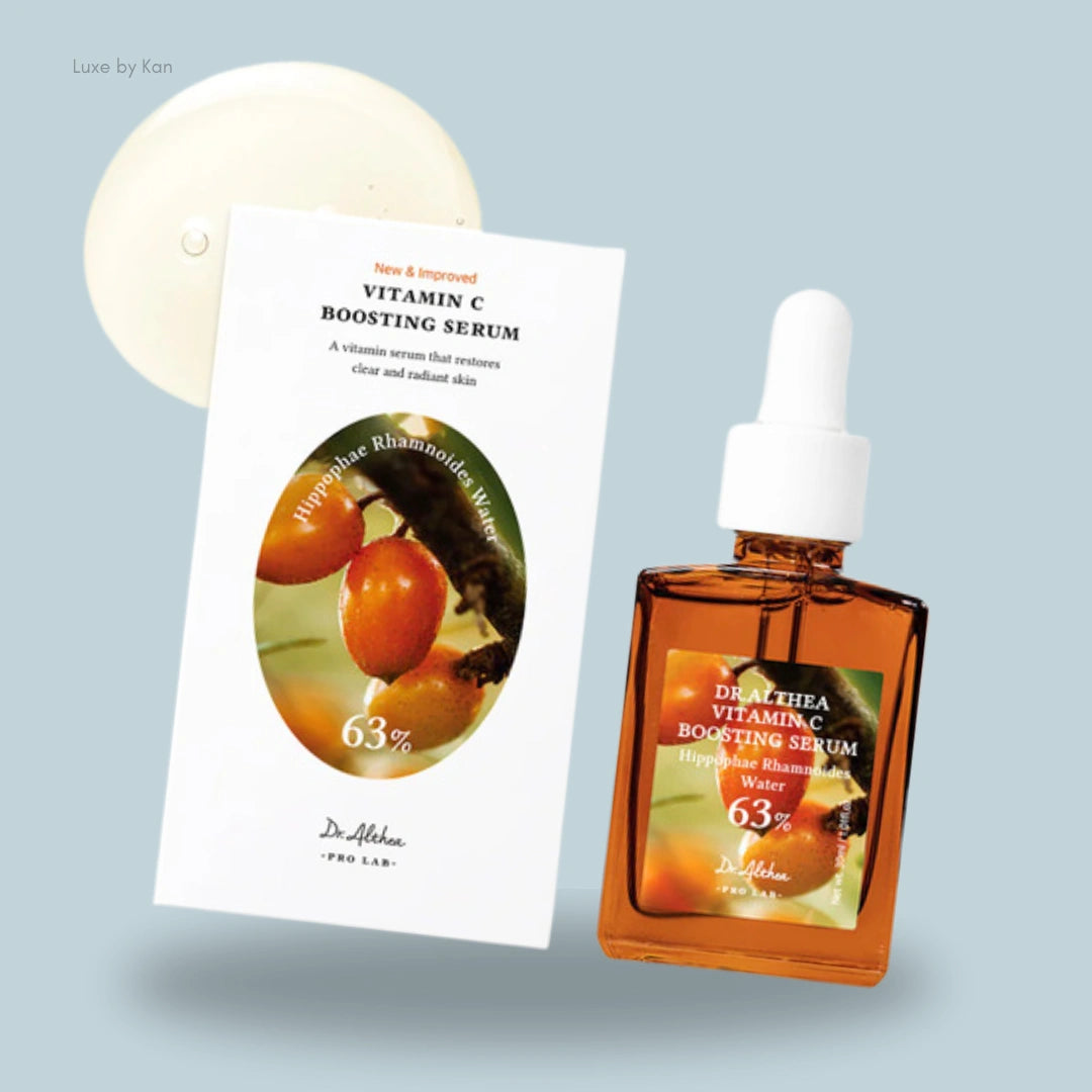 Dr. Althea Vitamin C Boosting Serum displayed alongside its product box featuring Hippophae Rhamnoides Water, with a visible droplet highlighting its lightweight, brightening formula.