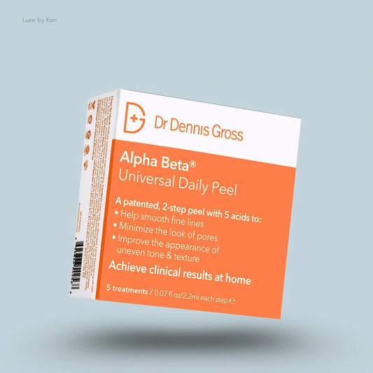 Box of Dr. Dennis Gross Alpha Beta Universal Daily Peel, highlighting benefits of smoothing lines and improving skin tone.