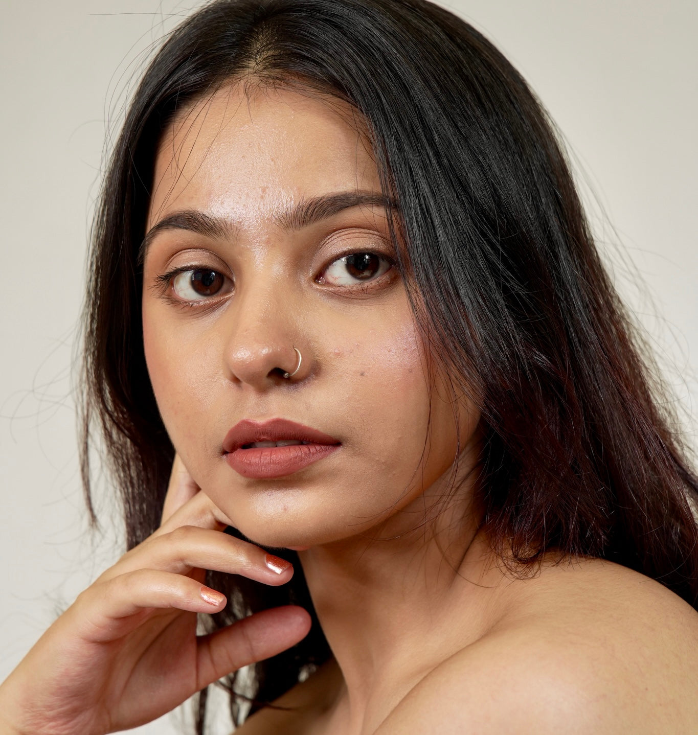 A woman face close-up with era beauty roman empire velvet liquid matt lipstick shade.