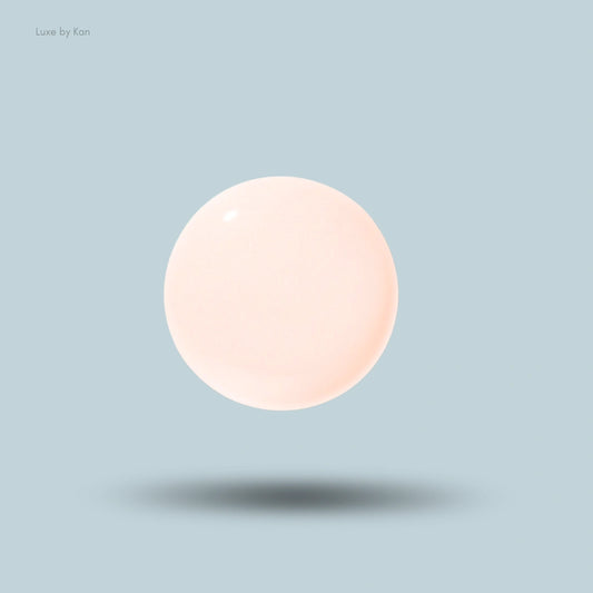 Giorgio Armani primer shown as a luminous, round sphere.