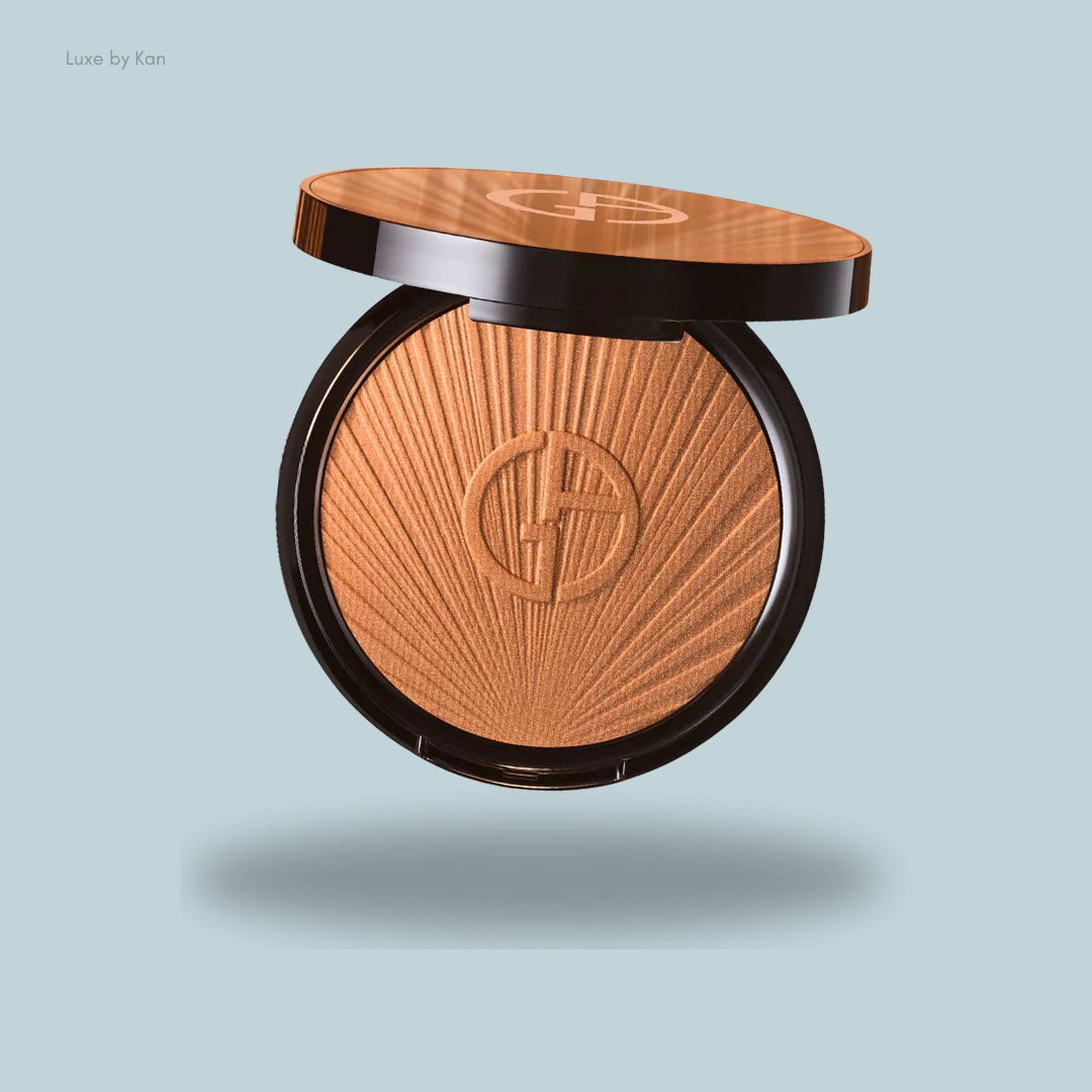 Giorgio Armani bronzer; open compact shows bronze powder with logo.