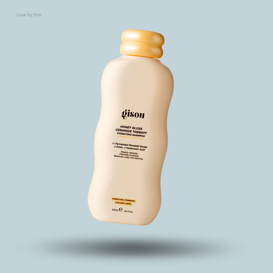 Gisou Honey Gloss Ceramide Therapy Shampoo bottle with yellow cap, highlighting its hydrating properties.