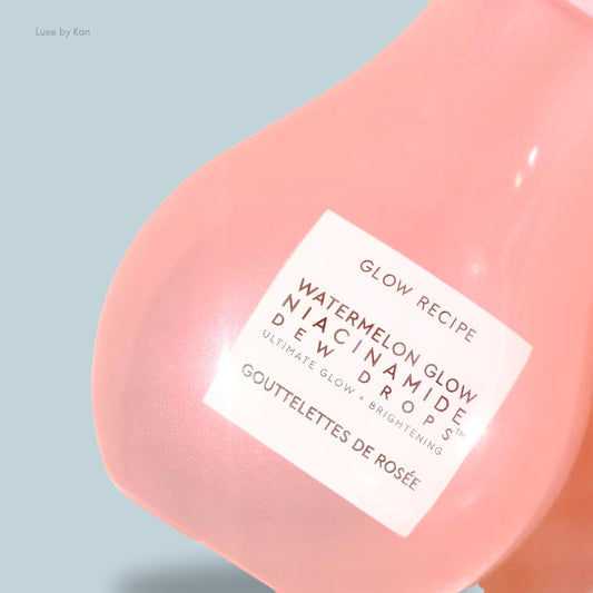 Pink bottle of Watermelon Glow Niacinamide Dew Drops from Glow Recipe, labeled for ultimate glow and brightening skincare.