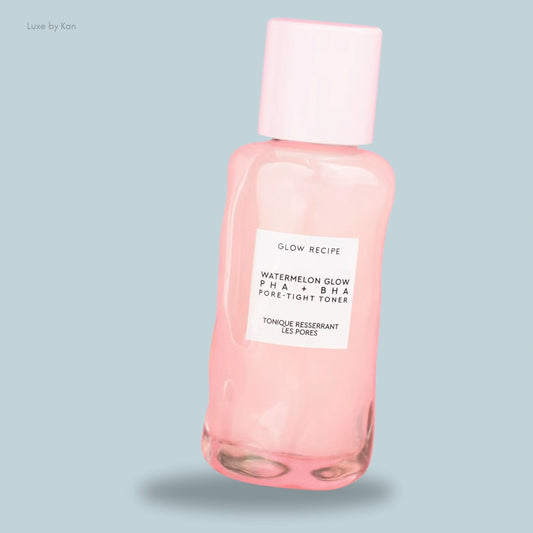 A bottle of Glow Recipe's Watermelon Glow PHA + BHA Pore-Tight Toner with a light pink cap.