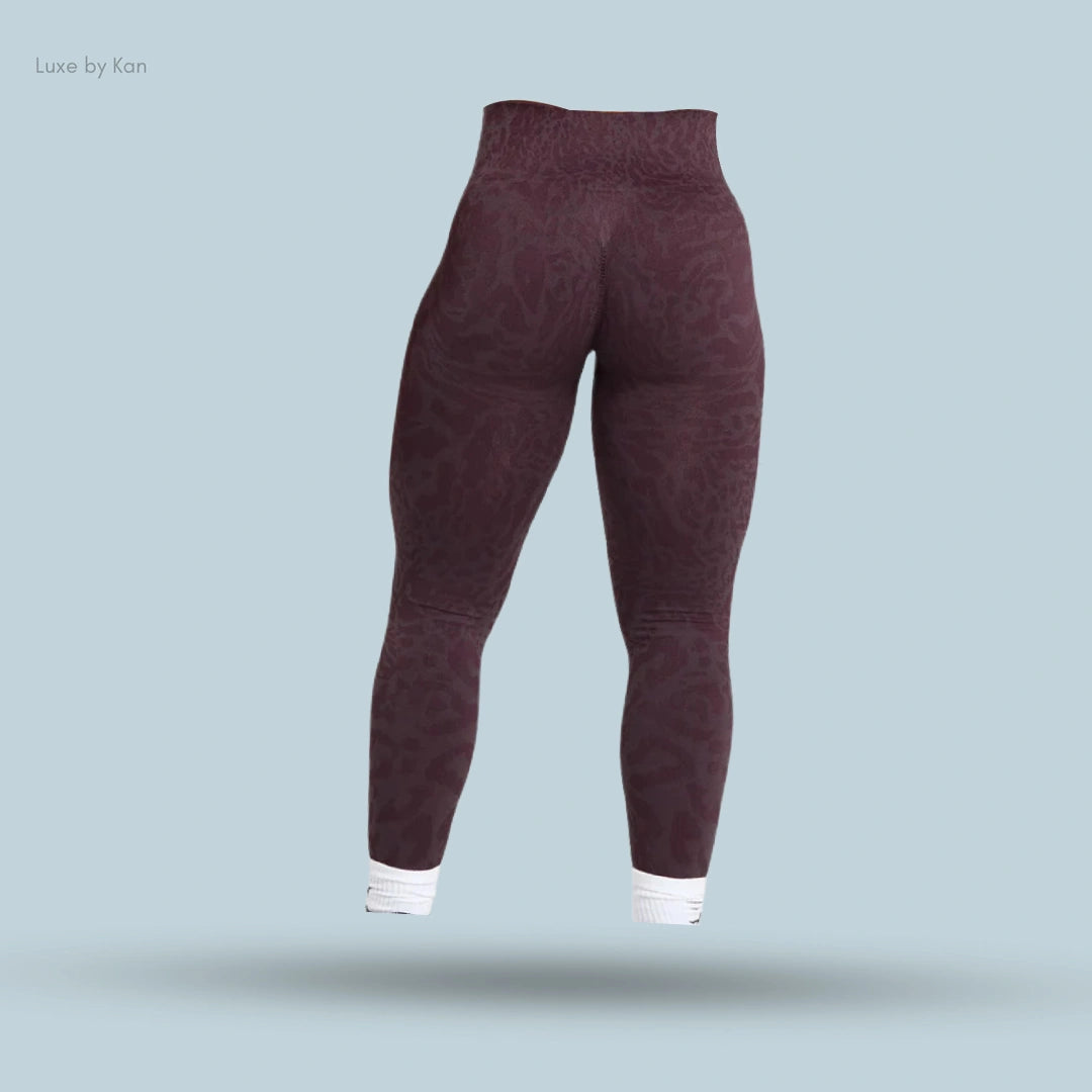 Gymshark maroon high-waisted leggings with a subtle animal print.