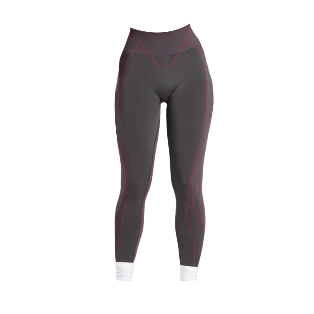 Gymshark Training Tights leggings in dark gray with pink accent stitching, designed for comfort and style during exercise.