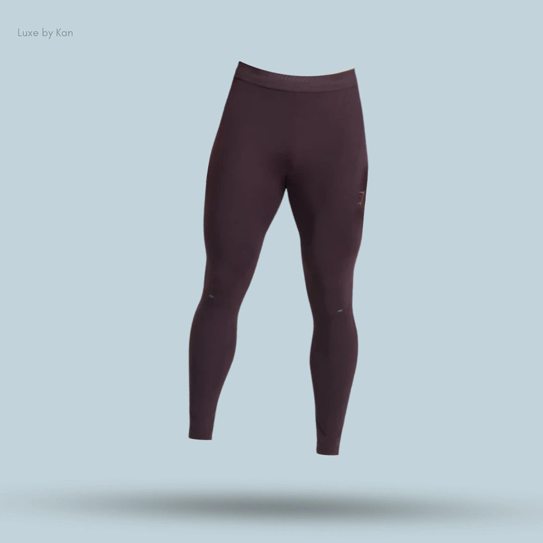 Maroon Apex Run Tights high-waisted leggings, featuring a sleek and form-fitting design.