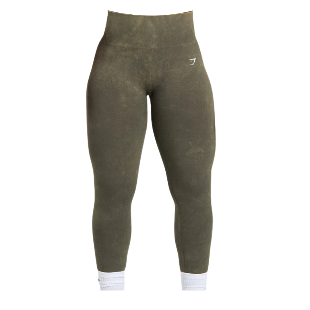 Olive green Gymshark Seamless Leggings featuring a high ribbed waistband, white logo on the upper left leg, and white ribbed ankle cuffs.