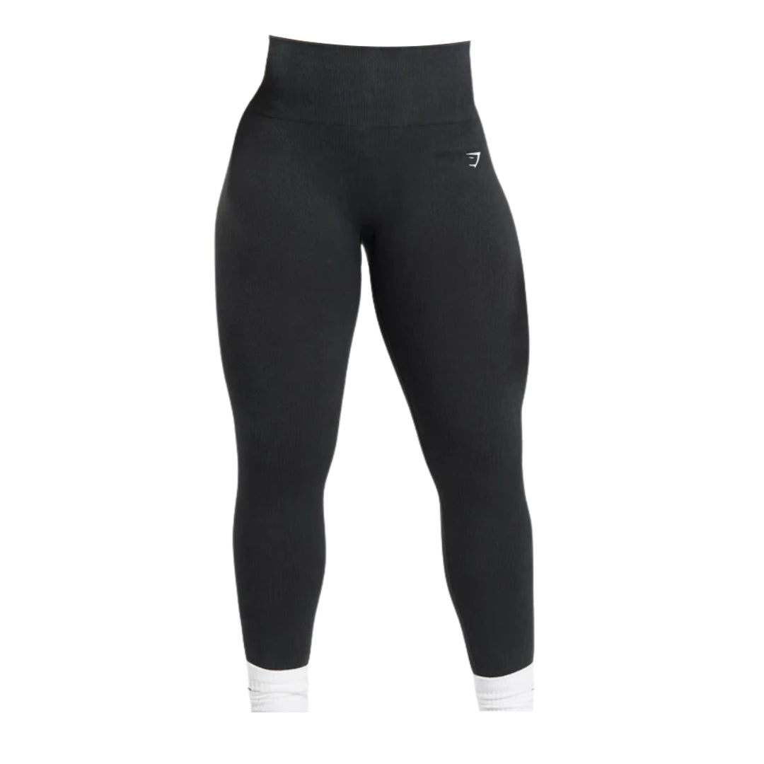 Black Gymshark high-waisted seamless leggings with a white logo on the hip.