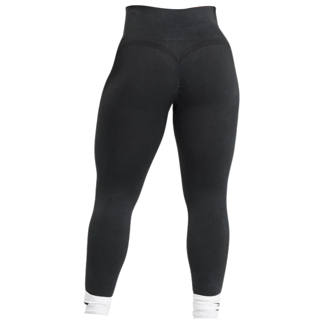 Rear view of black Gymshark Seamless Leggings featuring white ribbed ankle cuffs.