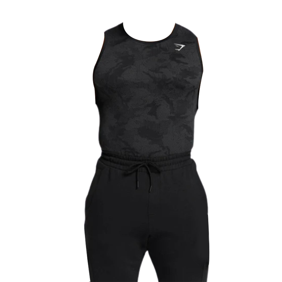 Men’s black sleeveless Gymshark Geo Seamless tank top with a camouflage pattern, paired with drawstring jogger pants, suitable for fitness activities.