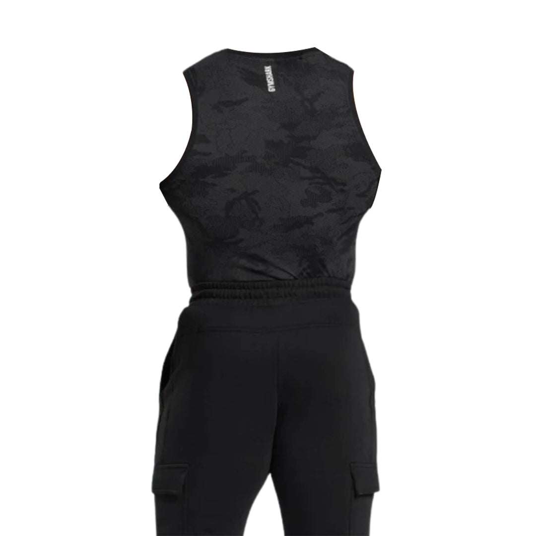 Back view of a black geo seamless tank top with a subtle camouflage pattern, paired with black cargo pants.
