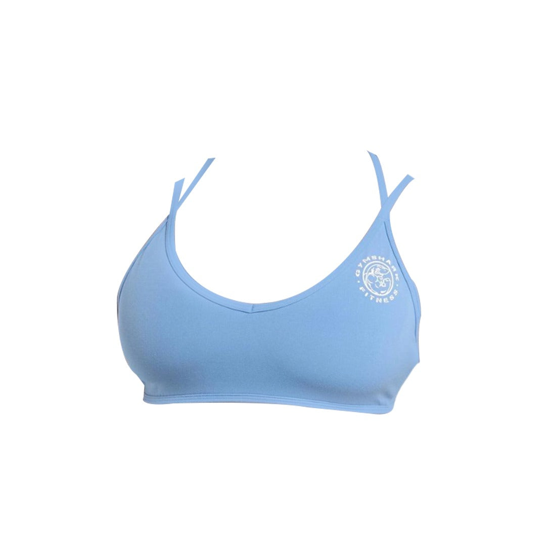 Light blue Gymshark legacy sports bra with thin adjustable straps and logo detailing on the left side, ideal for workouts or casual wear.