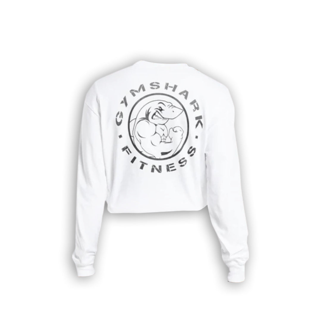 White cropped long-sleeve shirt featuring a black Gymshark logo with a muscular shark graphic on the back.