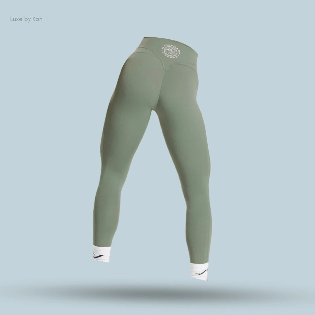 High-waisted, olive green leggings showcased from the back, featuring a decorative logo on the waistband.