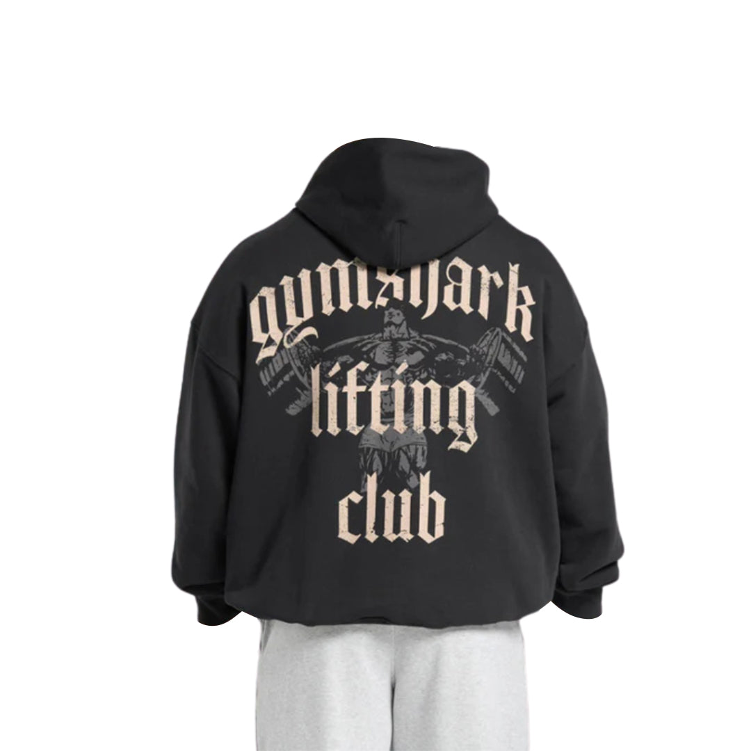 A black hoodie with "Gymshark Lifting Club" printed in bold beige letters and a weightlifter graphic on the back.