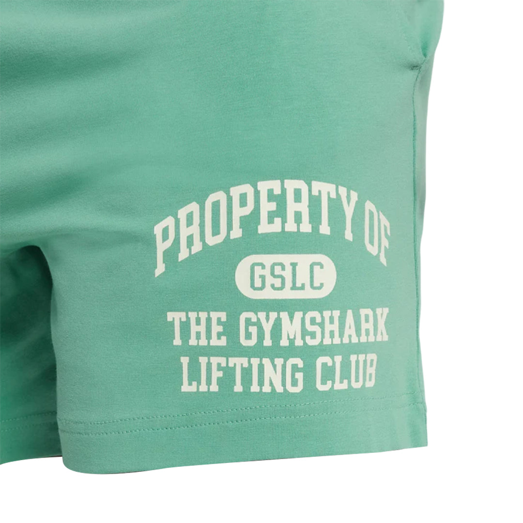 Close-up of mint-colored Gymshark jersey shorts featuring the white text "PROPERTY OF GSLC THE GYMSHARK LIFTING CLUB".