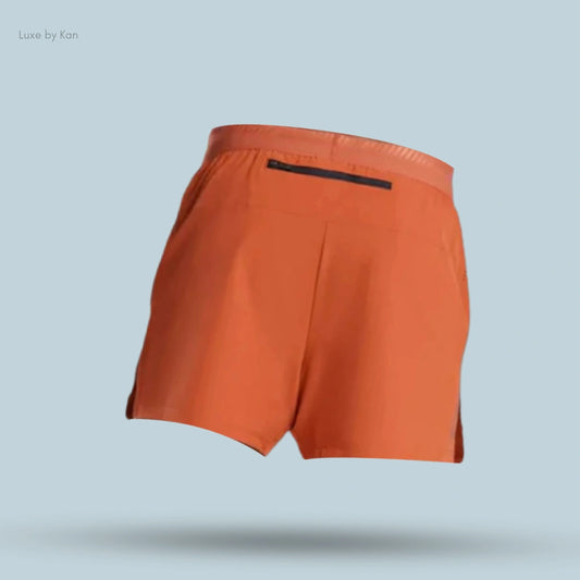 Gymshark Apex Run 4" shorts in a rust color with a black zipper pocket on the back.