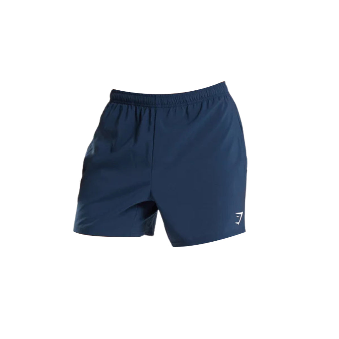 Men's navy blue Arrival 5" Shorts featuring a slim-fit design, an elastic waistband, and a small white Gymshark logo positioned on the lower side.